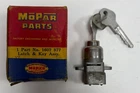 New Old Stock Glove Box Lock For 1955-58 Models Mopar #1607877. Price: $125.00.