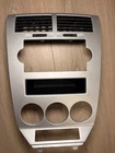 2007-09 Dodge Caliber Center Dash Radio Surround Bezel Climate Panel Silver Used. Price: $79.99.