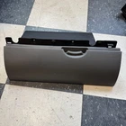 05-12 Nissan Frontier Pathfinder Xterra Charcoal Gray Upper Glove Box Used. Price: $39.00.