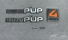 1981-1987 Isuzu Pup Emblem Set 4WD Fenders Cab Glove Box Oem Used. Price: $49.95.